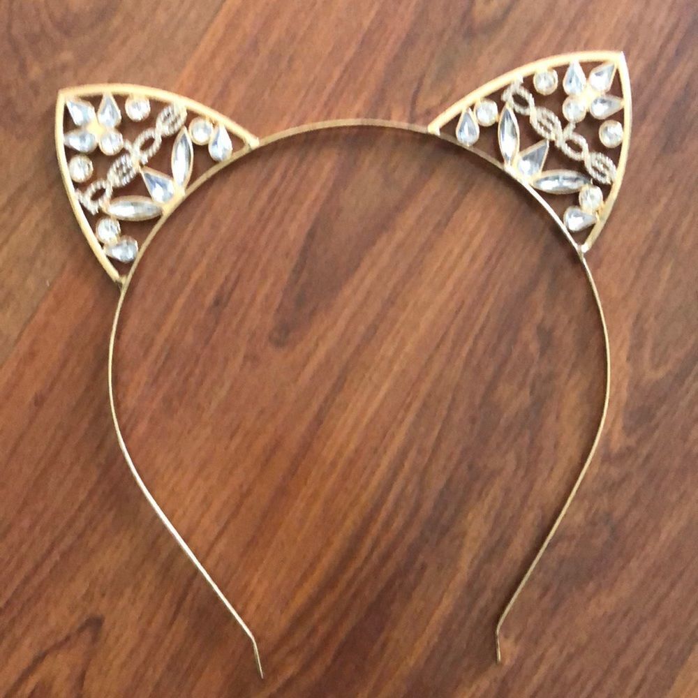 Bebe Gold and rhinestone cat ear headband.